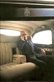Passenger on phone inside classic London taxi